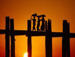 Crossing U Bein Bridge at Sunset, Near Amarapura, Myanmar